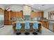 Gourmet kitchen with granite island and wooden cabinetry at 9045 E Chino Dr, Scottsdale, AZ 85255