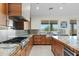 Modern kitchen with stainless steel appliances and a large center island at 9045 E Chino Dr, Scottsdale, AZ 85255