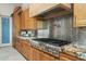 Kitchen features stainless steel appliances and granite countertops at 9045 E Chino Dr, Scottsdale, AZ 85255