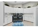 Bright laundry room with ample storage and modern appliances at 9045 E Chino Dr, Scottsdale, AZ 85255