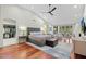 Large main bedroom with hardwood floors, walk-in closet and access to patio at 9045 E Chino Dr, Scottsdale, AZ 85255