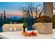 Elegant outdoor dining setup with mountain views at dusk at 9045 E Chino Dr, Scottsdale, AZ 85255