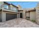 Modern home with a two-car garage and outdoor fireplace at 9127 N Fireridge Trl, Fountain Hills, AZ 85268