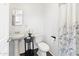 Small bathroom with a pedestal sink, toilet, and shower at 1021 E Roosevelt St, Phoenix, AZ 85006