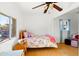 Bright bedroom with a full-sized bed and wood floors at 1021 E Roosevelt St, Phoenix, AZ 85006