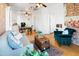 Bright living room features exposed brick wall, comfy seating, and kitchenette at 1021 E Roosevelt St, Phoenix, AZ 85006