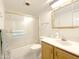 Bathroom featuring a vanity, sink, and bath tub with glass doors at 10330 W Thunderbird Blvd # A125, Sun City, AZ 85351