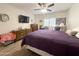 Comfortable bedroom with wood floors, television, and natural light at 10330 W Thunderbird Blvd # A125, Sun City, AZ 85351