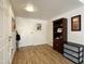 Entry way leading into the home with wood floors, closet, and storage at 10330 W Thunderbird Blvd # A125, Sun City, AZ 85351