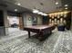 Well-appointed game room features a pool table and comfortable seating at 10330 W Thunderbird Blvd # A125, Sun City, AZ 85351