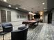 Elegant game room boasts a pool table, comfortable seating, and a flat-screen TV at 10330 W Thunderbird Blvd # A125, Sun City, AZ 85351