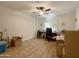 Office space with a ceiling fan, wood floors, and natural light from the windows at 10330 W Thunderbird Blvd # A125, Sun City, AZ 85351