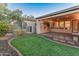 The property features a covered patio and a well-maintained backyard, enhancing outdoor living at 12750 W Jasmine Trl, Peoria, AZ 85383
