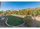 Artificial turf and gravel backyard with privacy hedge at 12750 W Jasmine Trl, Peoria, AZ 85383