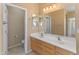 Double vanity bathroom with a toilet and shower at 12750 W Jasmine Trl, Peoria, AZ 85383