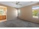 Spacious bedroom with carpet and large windows at 12750 W Jasmine Trl, Peoria, AZ 85383