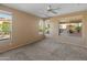 Primary bedroom with backyard views and ceiling fan at 12750 W Jasmine Trl, Peoria, AZ 85383