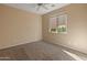 Bright bedroom with carpeted floor and window at 12750 W Jasmine Trl, Peoria, AZ 85383