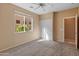 Spacious bedroom with double door closet and window at 12750 W Jasmine Trl, Peoria, AZ 85383