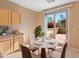 Bright breakfast nook with sliding glass doors to patio at 12750 W Jasmine Trl, Peoria, AZ 85383
