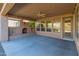 Covered patio with ceiling fan and access to backyard at 12750 W Jasmine Trl, Peoria, AZ 85383