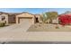 Single-story home with desert landscaping and two-car garage at 12750 W Jasmine Trl, Peoria, AZ 85383