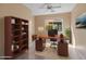 Functional home office with built-in shelving and desk at 12750 W Jasmine Trl, Peoria, AZ 85383