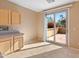 Kitchen with door leading to backyard patio at 12750 W Jasmine Trl, Peoria, AZ 85383