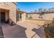 Covered patio with flagstone flooring and built-in fireplace at 12750 W Jasmine Trl, Peoria, AZ 85383