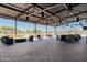 Spacious covered patio with comfortable seating and views of the community at 12750 W Jasmine Trl, Peoria, AZ 85383