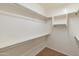 Large walk-in closet with double hanging rods and shelves at 12750 W Jasmine Trl, Peoria, AZ 85383
