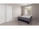 Bedroom with carpeted floors, a window, and a closet with sliding doors at 12937 W Highland Ave, Litchfield Park, AZ 85340