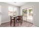 Cozy dining area with stylish table, chairs, and sliding glass doors at 12937 W Highland Ave, Litchfield Park, AZ 85340