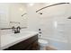 Bathroom with a sleek vanity, white countertop and a tub and shower with dark bronze hardware at 1436 E Cherrywood Pl, Chandler, AZ 85249
