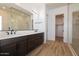 Modern bathroom featuring a double vanity, framed mirror, and glass-enclosed shower at 1436 E Cherrywood Pl, Chandler, AZ 85249