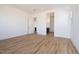 Spacious bedroom with wood-look tile flooring and doorways to other rooms at 1436 E Cherrywood Pl, Chandler, AZ 85249