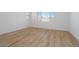 This bedroom features bright windows and wood-style flooring at 1436 E Cherrywood Pl, Chandler, AZ 85249