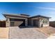 Modern home featuring a stylish two-car garage and decorative driveway at 1436 E Cherrywood Pl, Chandler, AZ 85249
