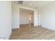 Hallway view featuring the tile flooring, white trim and an open concept at 1436 E Cherrywood Pl, Chandler, AZ 85249