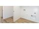 The laundry room features tile flooring and white walls at 1436 E Cherrywood Pl, Chandler, AZ 85249