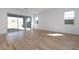 Open living area featuring tile flooring and a sliding glass door to the patio at 1436 E Cherrywood Pl, Chandler, AZ 85249
