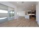 Spacious living area featuring tile flooring, recessed lights, and sliding glass door at 1436 E Cherrywood Pl, Chandler, AZ 85249