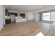 Open living and kitchen area with tile floors and sliding glass doors at 1436 E Cherrywood Pl, Chandler, AZ 85249