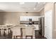 Modern kitchen with an island and white cabinets at 15825 W Durango St, Goodyear, AZ 85338