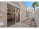 Covered patio shows sliding glass doors opening to living space; note desert landscaping at 15858 S 11Th Pl, Phoenix, AZ 85048