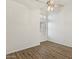 Bedroom featuring a ceiling fan, wood-look floors, and a window with blinds at 15858 S 11Th Pl, Phoenix, AZ 85048