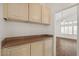 Butler's pantry with cabinets, countertop space, and view to the main living area at 15858 S 11Th Pl, Phoenix, AZ 85048