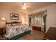 Spacious bedroom with king-size bed and bay window at 16167 W Quail Creek Ln, Surprise, AZ 85374