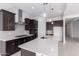 Well-lit kitchen featuring an island, modern appliances, and pendant lighting at 17585 W Blue Sky Dr, Surprise, AZ 85387