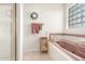 Well-lit bathroom features a pink bathtub, and a glass block window at 17645 E Stacey Rd, Queen Creek, AZ 85142